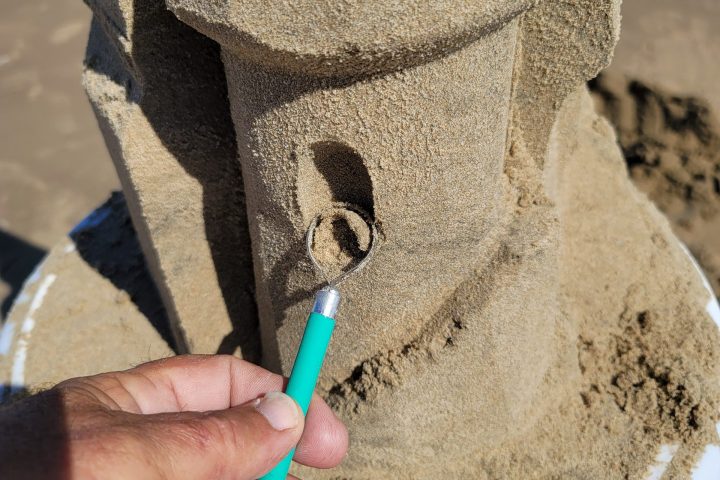 a person holding a toothbrush